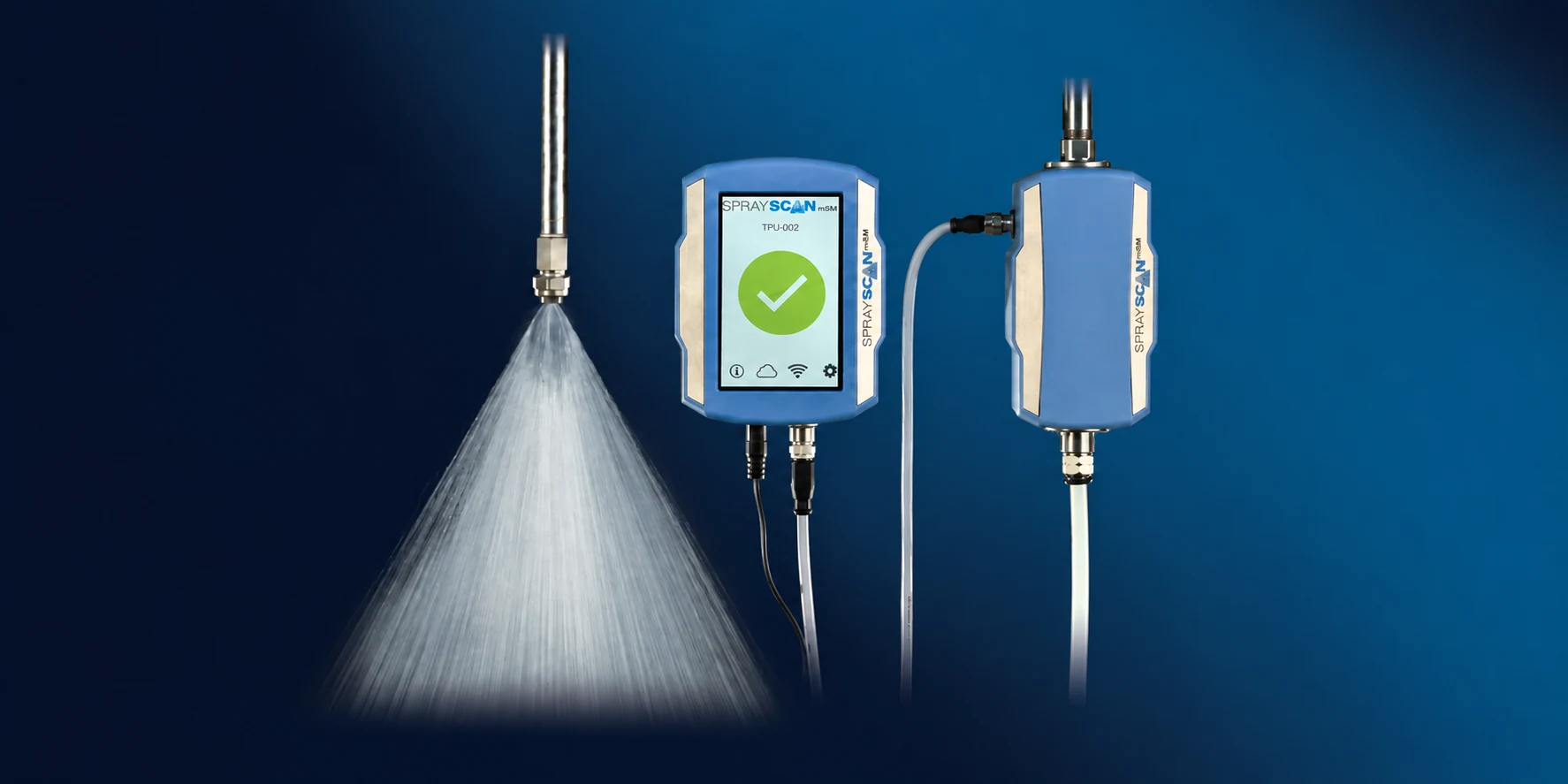 SprayScan mSM display unit and inline sensor beside an active spray nozzle